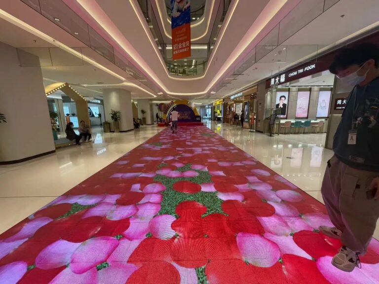 Installed LED floor showing illuminated graphics in a commercial interior